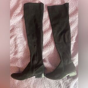 Black thigh high ALDO boots. Gently worn- great with a mini skirt or some jeans!